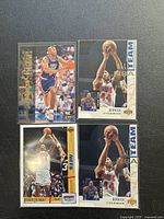 Four 1994 Upper Deck basketball trading cards featuring Derrick Coleman showing front views of each card in protective sleeves.