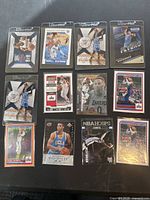 Top view of 12 Russell Westbrook basketball trading cards arranged in a grid, showing various card designs and action shots.