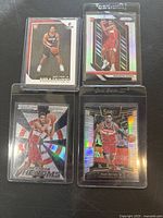 Four 2018 Panini basketball rookie cards with Gary Trent Jr. and Troy Brown Jr. in protective sleeves, showing front of each card.
