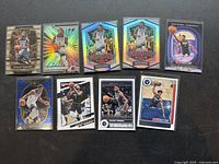 Top-down photo showing 9 Anthony Edwards basketball cards with premium and base card designs