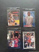 Four basketball cards of Clarance Weatherspoon on black background, each card in Ultra PRO sleeve, showing player in various action and portrait shots.
