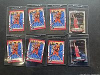 Eight basketball cards all featuring Demar Derozan. Seven Donruss cards with uniform design and a Fleer 95 card showing a Dunk scene. Cards are sleeved individually in plastic protective holders.