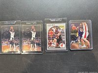 Four Glen Rice basketball cards laid out, two Ultimate Final Four cards, one NBA Hoops rookie card, one other action card