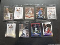 Nine Rajon Rondo basketball cards laid out on a surface in protective sleeves showing the front view of each card with various backgrounds and colors.