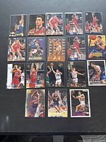 Top view of 18 Tom Gugliotta basketball cards arranged in 3 rows