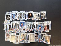 Full layout of 63 basketball trading cards showing various players, coaches, and basketball-related images with Coca Cola branding.