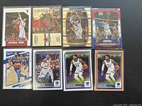 Top-down photo showing all 8 Derrick Rose basketball cards arranged in two rows of four on a neutral surface.