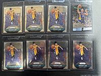 Eight Jeremy Lin basketball trading cards from Panini placed in two rows, visible player in action on each, all cards in protective Ultrapro sleeves.