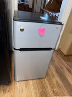 Full view of the Haier bar fridge showing front and height proportions.