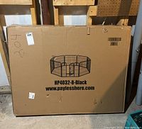 Boxed black metal pet enclosure with 8-panel octagonal design image on box.