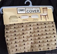 Front view of packaged chair pad cover showing product branding and usage instructions.