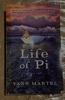 Front cover of Life of Pi paperback showing title, author, and thematic cover image with tiger on boat.