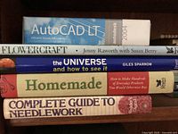 Photo showing the stacked books and boxed software in the lot.