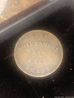 Obverse of trade token with text 'SELF GOVERNMENT AND FREE TRADE'.