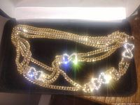 Gold plated chunky chain necklace with silver rhinestone decorated links.