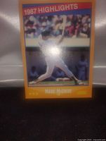 Front view of Mark McGwire 1987 Highlights baseball card showing the player batting.