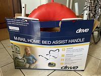 Original boxed Drive M-Rail home bed assist handle showing label and handle partially visible.