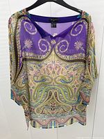 Front view on hanger showing overall paisley pattern and silhouette