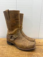 Side view showing right boot harness strap and profile