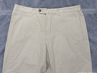 Front waist and upper leg view on towel background