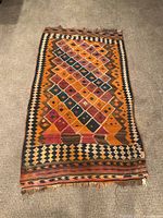 Full view showing central diamond lattice pattern and borders