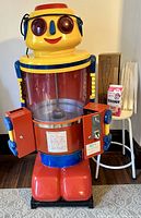 Full front view showing robot machine, stool and supplies