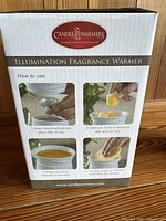 Box showing instructions for Illumination Fragrance Warmer use with four step photos.