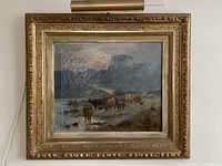 Full view of framed oil painting with included picture light mounted above