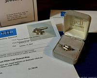 Ring and appraisal certificate displayed in Adi Fine Jewellery box