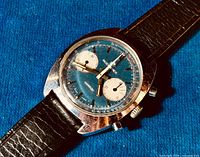 Oblique view of case and dial showing blue dial and white subdials