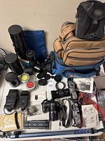 Overview of cameras, lenses, bags, flashes, filters, straps, monopod.