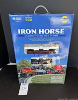 Front of original blue box labeled 'Iron Horse' with visible brown GP38-2 locomotive model through window.