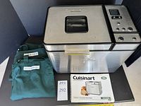 Cuisinart convection bread maker with two green aprons and instruction manual