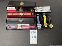 Full lot of 7 wristwatches, 2 in Lorus boxes, 3 Disney themed with colorful straps, 2 additional watches.