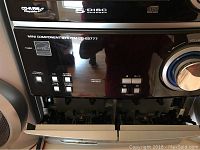 Close-up front view of the Sharp CD-ES777 mini component stereo with 5-disc CD changer and tape decks.