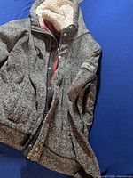 Grey knit Abercrombie & Fitch hoodie with sherpa lining, laid flat showing front, zipper, and snap buttons.