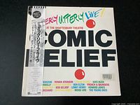 Front cover of the vinyl record showing the title and colorful design with Japanese obi strip.