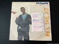 Front cover of vinyl record album titled 'He's The DJ' featuring DJ Jazzy Jeff on cover.
