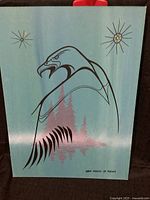 Photo of original painting titled 'Wob Shikis Id Mkwas (White Bear)' by Norman Knott, showing abstract eagle over a pink forest landscape with star accents on a greenish background, signed.