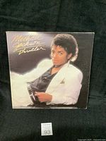 Front of the Michael Jackson Thriller vinyl record album cover showing artist and artwork.