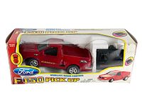 Original packaging box showing red Ford F150 pickup truck toy and wireless remote controller inside.