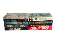 Stack of 9 hardcover Isaac Asimov books showing the spines and titles.