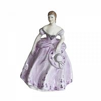 Front view of the Coalport Ladies of Fashion 'Karen' bone china figurine in lilac dress holding a hat.