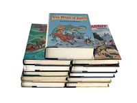 Stack of 11 hardcover Piers Anthony fantasy books, showing top book The Magic of Xanth with colorful dust jacket artwork.