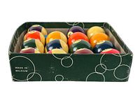 Side view of the billiard balls arranged in the box with visible