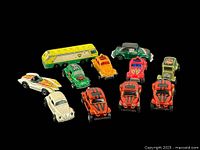 Overview of the lot showing all 10 vintage toy cars including VW Bugs, sports cars, pickup, and BP bus.