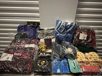 Overview of lot showing all bags and accessories sealed in plastic bags and packaging.