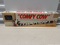 Photo of boxed Comfy Cow Draft Dodger showing product and branding on front of box.