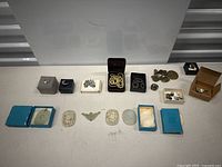 Overview of entire lot on tabletop showing rings, earrings, necklaces, bracelet and pendants