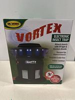 Front view of the boxed Vortex electronic insect trap with branding, features, and insect targets listed on box.